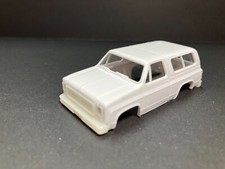 AUTO-WORLD " '77 CHEVY BLAZER " unpainted BODY NEW for AFX AURORA HO