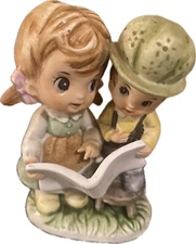 Vintage Artmark figurine girl reading to a little boy
