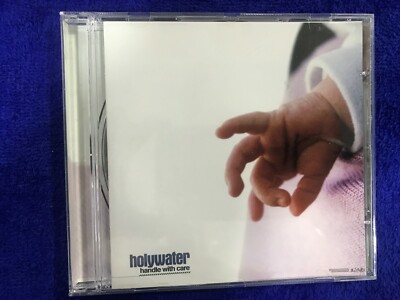 HOLYWATER CD HANDLE WITH CARE GRABADO EN VIGO