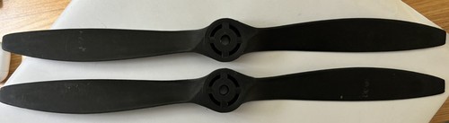 Black DYNATHRUST propeller blades with silver hubs and visible screw holes, made in the USA PRE-OWNED.