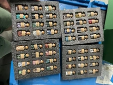 A Set of 45 Different Crystal Gemstones in Glass Bottles,