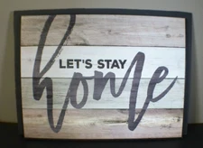 Let's Stay Home Wooden Wall Sign by Marla Rae with mock wood floor background 