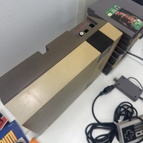 Nintendo NES Console Bundle + 11 Games Mario NFL Controllers Gun Cords Booklets