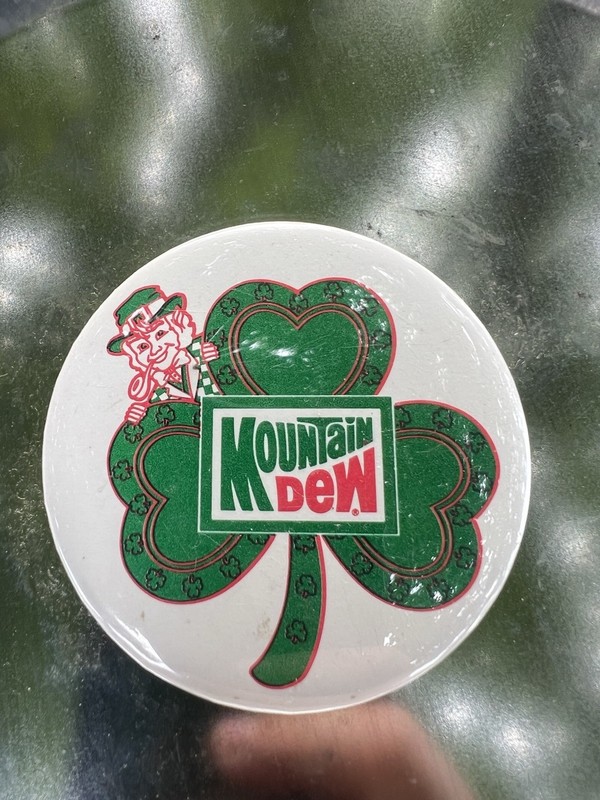 VTG MTN Mountain Dew Pin Back Button Green Clover Leprechaun St. Patrick's Day
