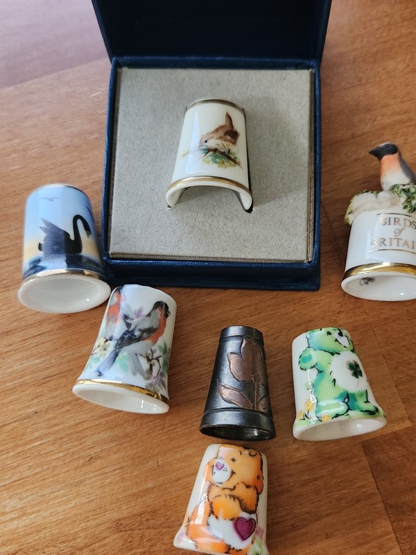 Mix Of Thimbles Care Bears-House Wren-Swan And More