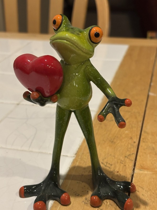 Frog Holding A Heart Figurine