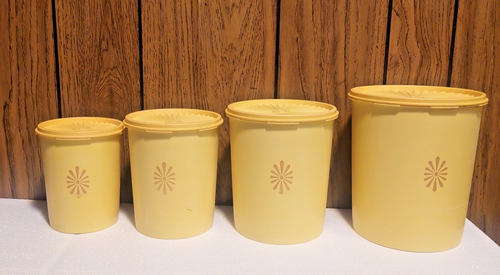 vintage Tupperware set of 4 nesting cannisters with lids yellow sunburst 70s