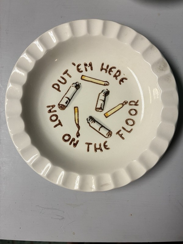 Vintage Ceramic ashtray With Scalloped Edgeand painted Pictures of cigarettes.