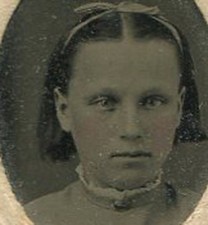 YOUNG GIRL WITH HAIR BOB AND RIBBON. TINTED TINTYPE, PERIOD PAPER MAT.