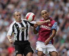 Stephen Carr of Newcastle United is challenged by Aston Villa goal- Old Photo