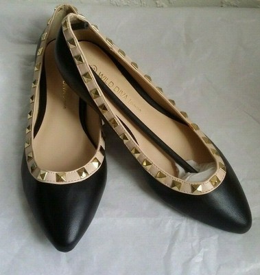 black flats with gold trim