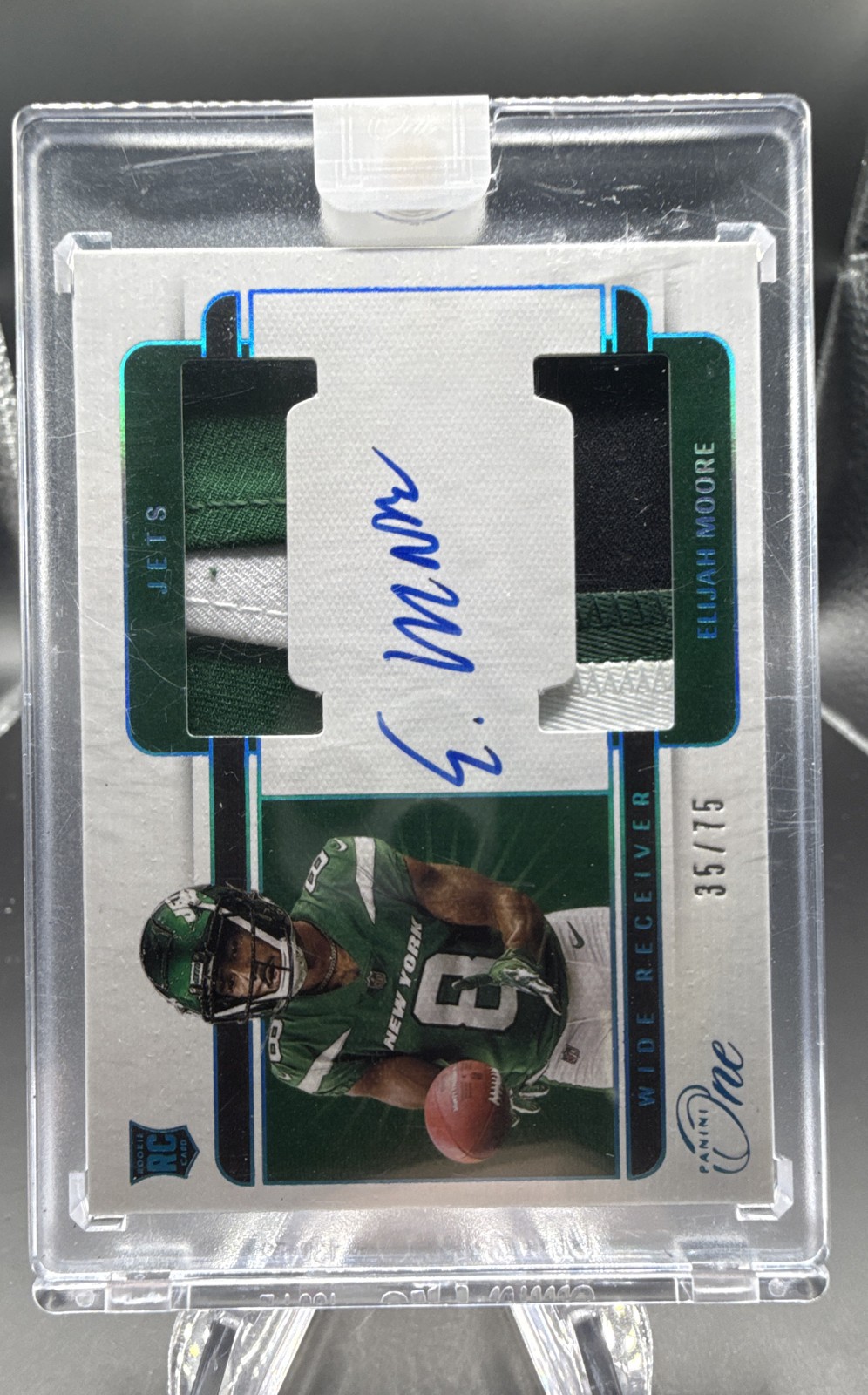 2021 Panini One - Rookie Dual Patch Autograph Elijah Moore #44 Blue /75 (AU,...
