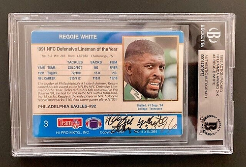 REGGIE WHITE BEAUTIFULLY SIGNED CARD WITH BECKETT COA ENCASED IN PLASTIC.