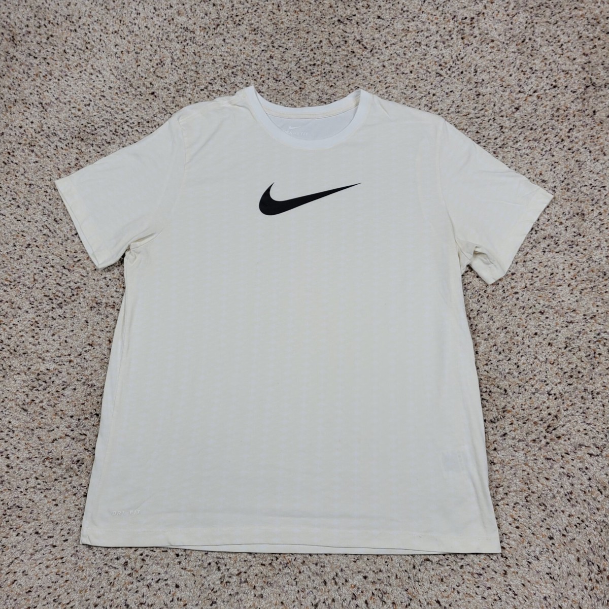 white and tan nike shirt