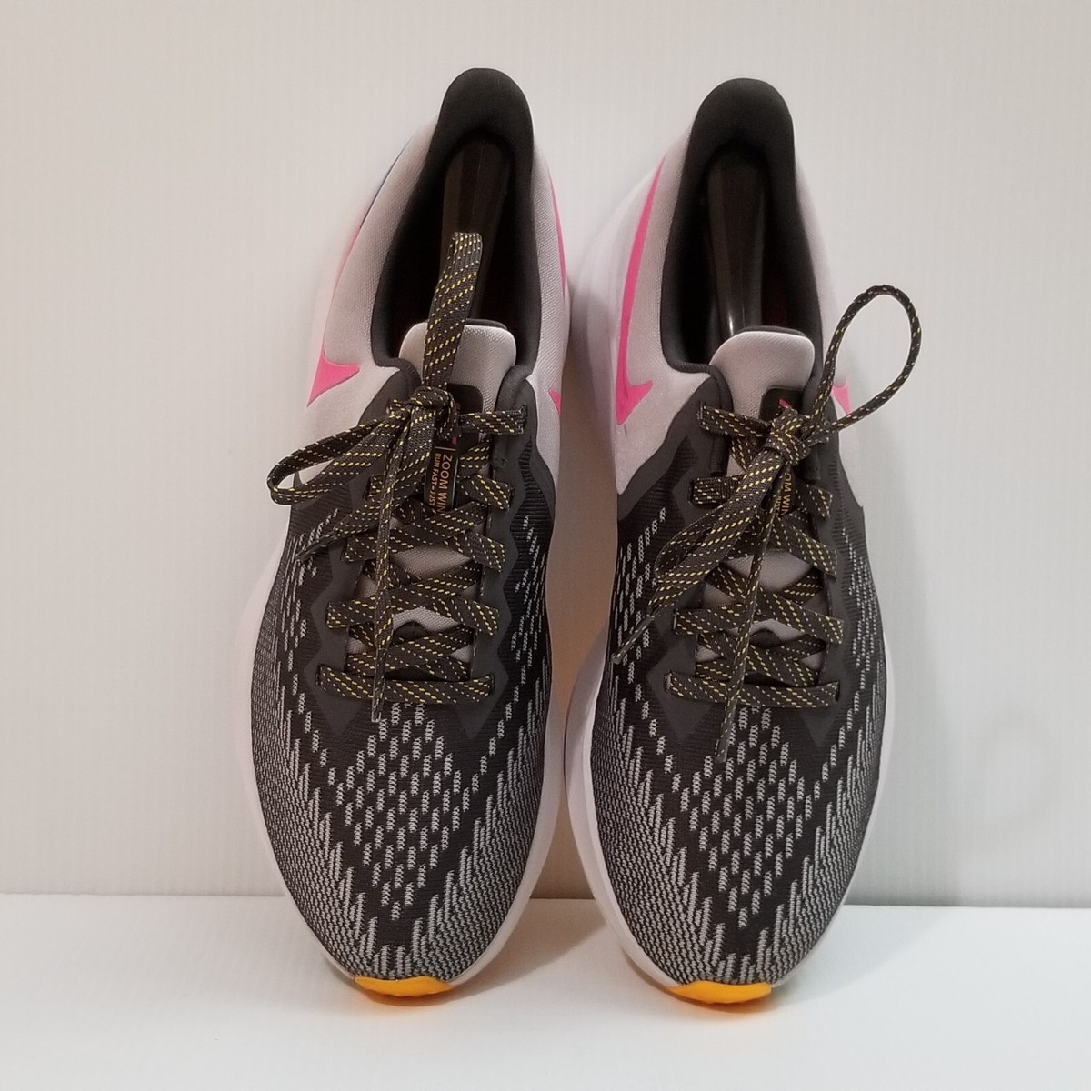Nike Black Athletic Sneakers with Yellow Swoosh and Pink Accents Nike is adding A main image 4