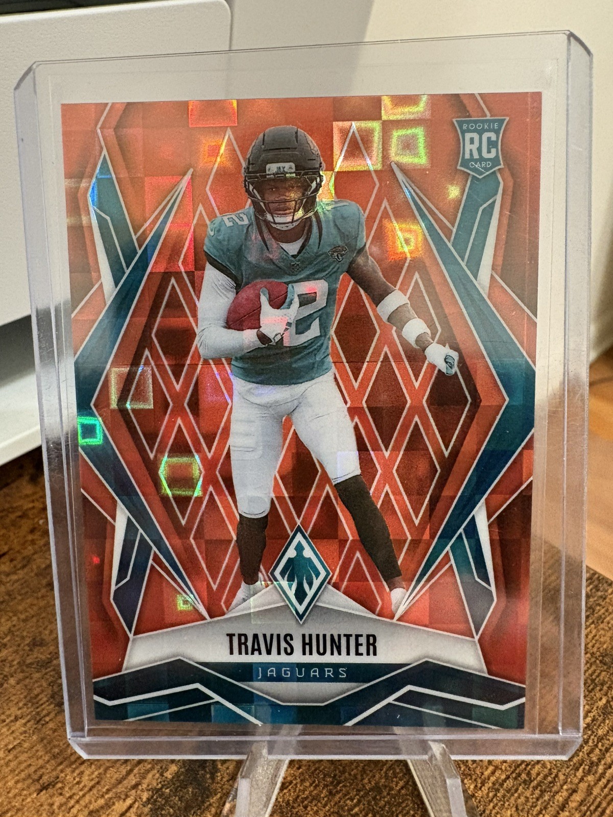 2025 Panini Phoenix #157 Travis Hunter Orange Pandora #/189 Jaguars RC