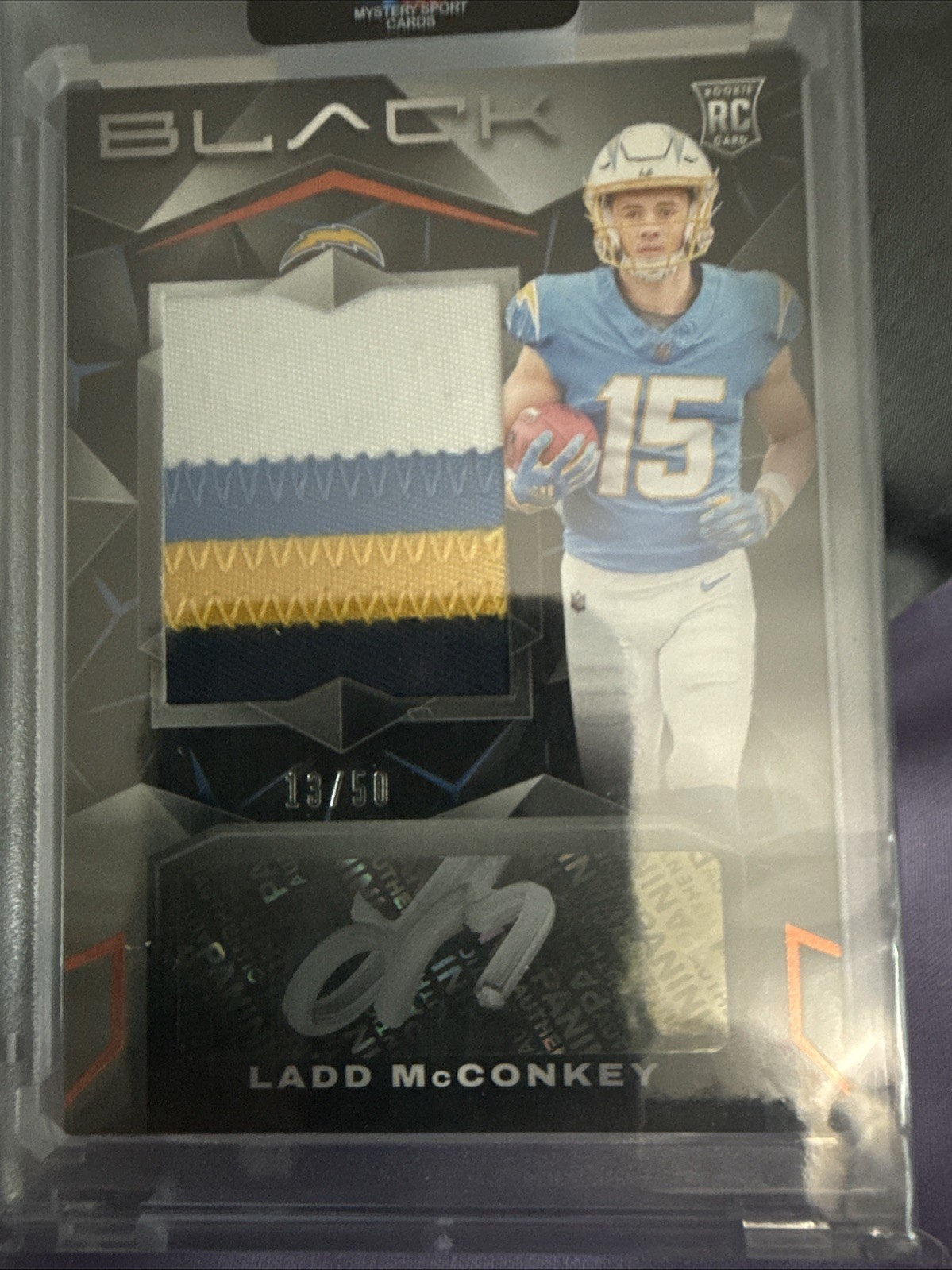 2024 Panini Black - Rookie Patch Autograph Ladd McConkey #211 /249 (AU, MEM, RC)