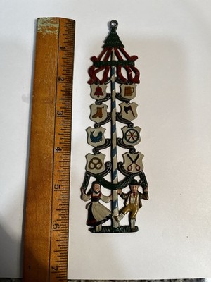 Kuhn Zinn ornament features traditional German Maibaum - maypole tree.