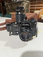Minolta XE-7 35mm SLR Film Camera Body With 2 Lenses, Case, and Flash