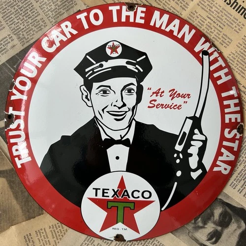 VINTAGE TEXACO TRUST YOUR CAR TO MAN W STAR 12 INCH CONVEX PORCELAIN ENAMEL SIGN
