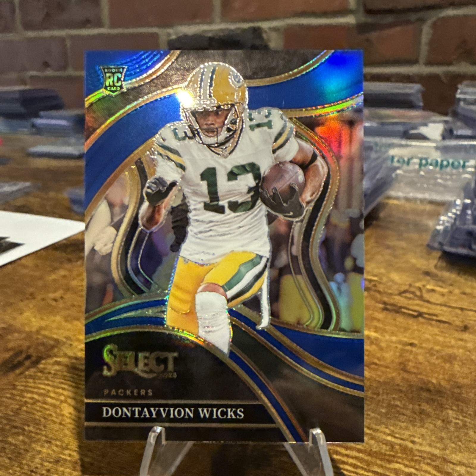 2023 Select Dontayvion Wicks Rookie 63/99 Blue Prizm Club Level Packers