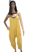 Free people movement Hot shot jumpsuit in a yellow color size XS