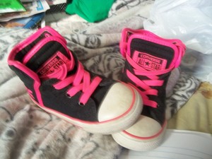 black converse with pink trim