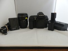 Olympus EVOLT E-3 10.1MP with Olympus 14-54mm lens. Shutter count is only '91'.