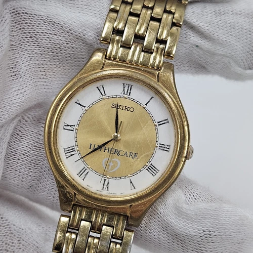Vintage Seiko Quartz Watch Men Gold Tone 34mm V701-1Y70 Luther Care Advertising