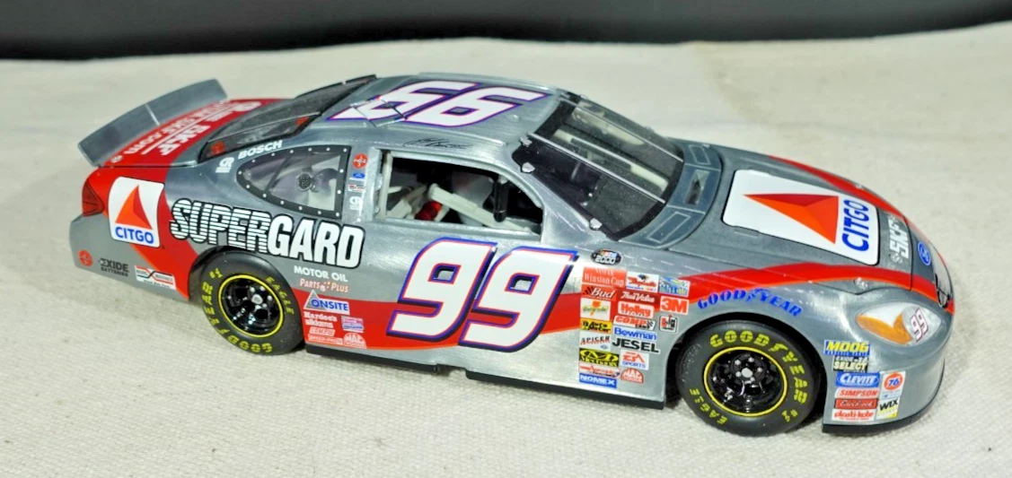 Team Caliber 1/24 Ford Taurus #99 Exide - P992012EX-A - Diecast - Occasion