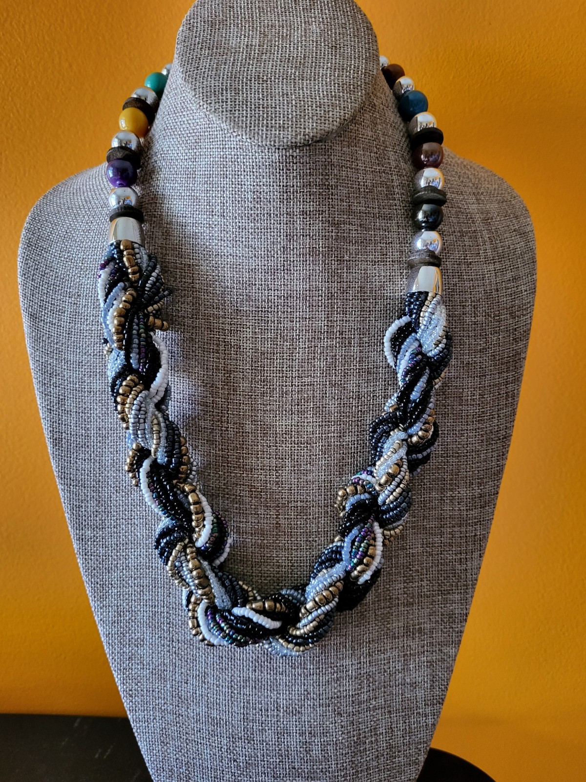 Multi-strand interwoven beaded necklace