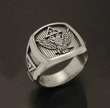 Raised Double Eagle emblem with a lowered black oxidized background Men's Ring