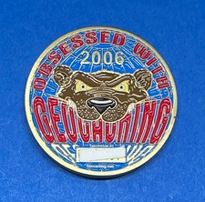 Geocoin 2006 DGRENO Obsessed With Geocaching Grizzly Bear Ant. Gold Unactivated