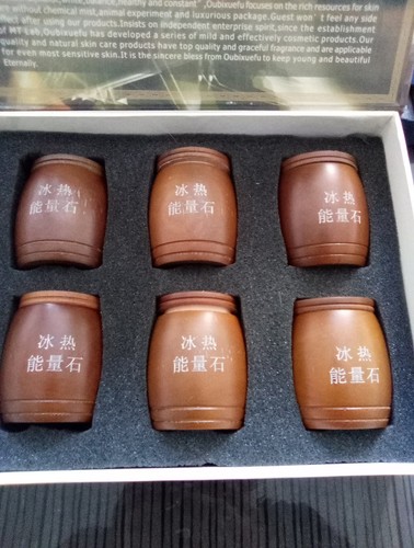 OBISS brand Hot and cold message balls made of polished stone.