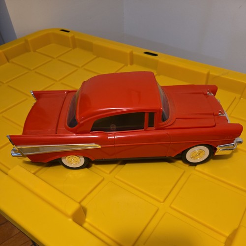 Vintage Red 57 Chevrolet toy car model display and VHS Tape Rewinder
