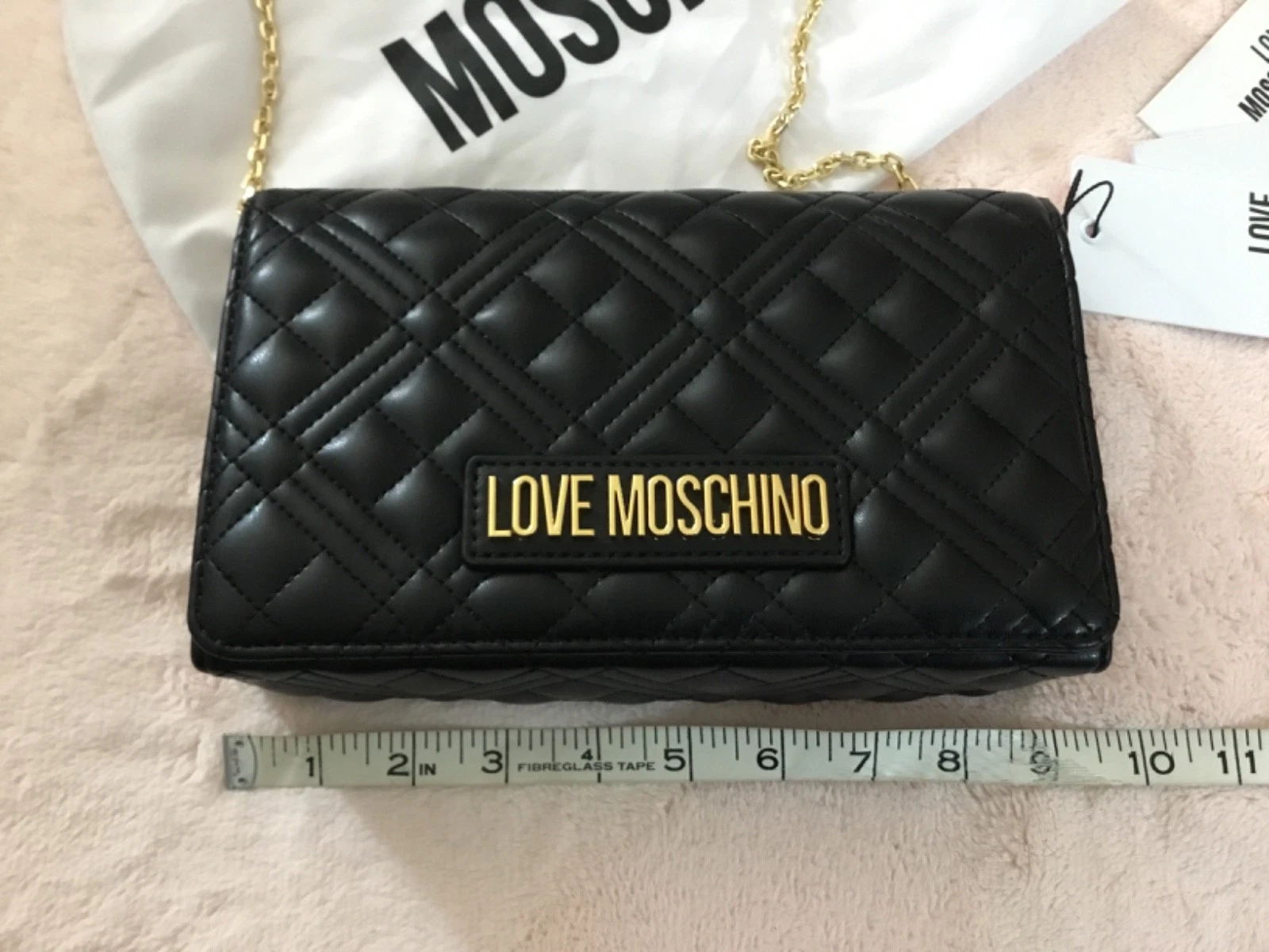 Love Moschino Borsa pochette trapuntata a tracolla con tracolla a catena nero oro