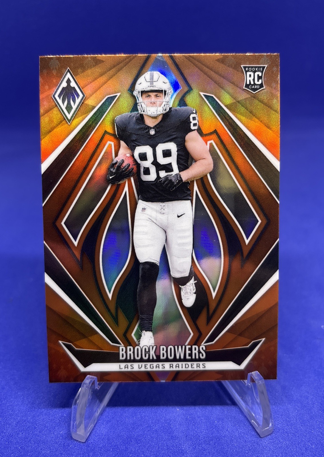 2024 Panini Phoenix - Rookies Brock Bowers #165 Orange Fade (RC)
