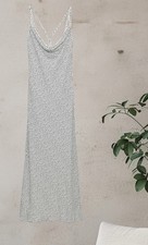 NWTZARA FLUID NECK DRESS WITH THIN STRAPS THAT CROSS AT BACK. FITTED WAIST