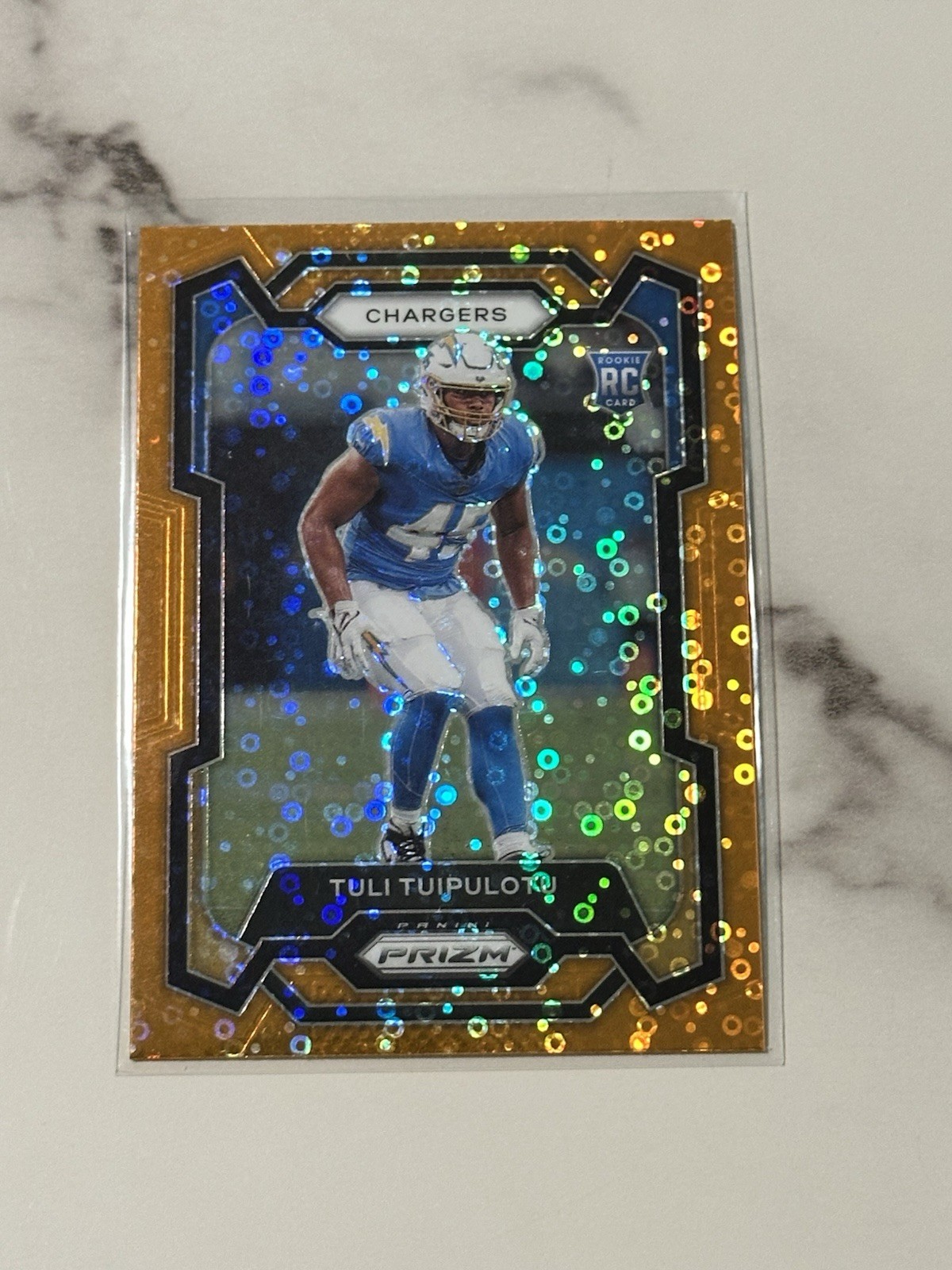 2023 Panini Prizm - Rookies Tuli Tuipulotu #354 Orange Disco Prizm (RC)