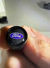 4pcs Ford Car, Truck or SUV Logo Domed on Black Aluminum Tire Valve Stem Cap Set