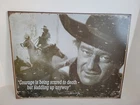 JOHN WAYNE COURAGE IS BEING SCARED BUT SADDLING UP METAL TIN SIGN