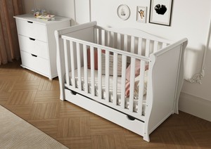 white cot with storage