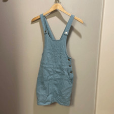 Urban Outfitters woman’s baby blue pinafore