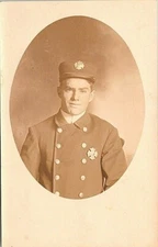 RPPC Firefighter Studio Pose in Dress Uniform w/ Badges early 1900s