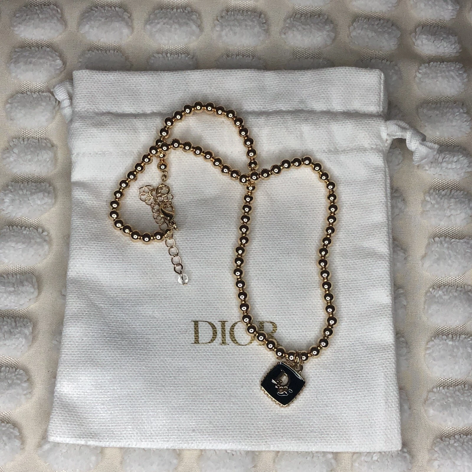 Collier Dior authentique upcyclé fermeture éclair/breloque ton or avec sac à poussière