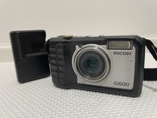 Fotocamera digitale RICOH G600 usata con graffi, usura ottica ed esterna