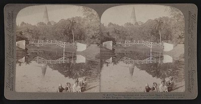 The fortress garden with famous Shwe Dagon Pagoda mirrored in its lake,