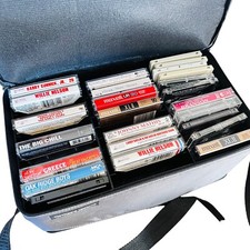 lot of vtg cassette tapes in a double sided zip up case