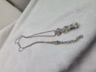 2This is a Brighton cross pendant and chain lanyard, often used as an ID badge — photo 7