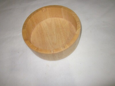 wooden bowl solid well made brown used wear tear some hole on top layer for tool